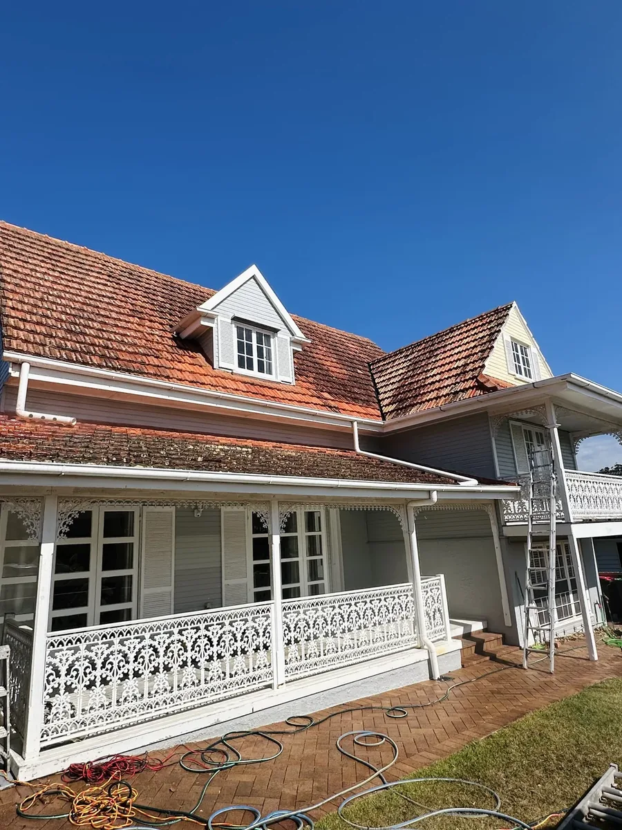 Gold Coast house and tiled roof before professional roof cleaning